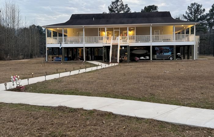 Accessible lake-front 4 bedroom home with TONS of outdoor covered space!