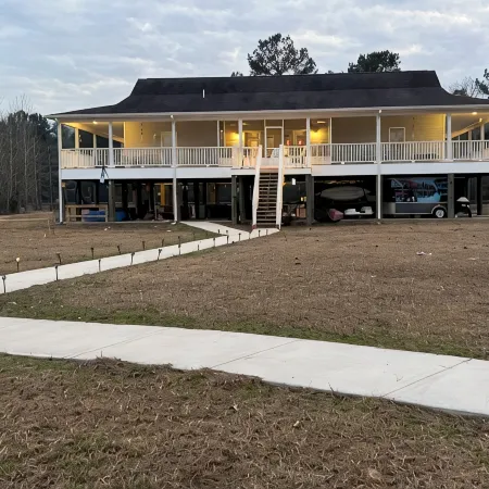 Accessible lake-front 4 bedroom home with TONS of outdoor covered space!