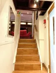 Live in this iconic East Side lower level apartment