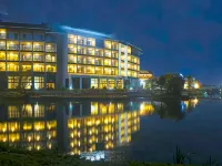 Lijiang ancient city Zangyuan snow mountain view hotel (big water wheel shop) فنادق في ليجيانغ