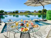 "Luxury Lakefront Paradise: Heated Pool Haven with Unrivaled Views"