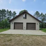 Three bedroom hide-a-way with spacious deck over looking Island Lake.