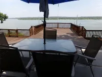 Spectacular lake view with a huge deck and a Hot Tub.
