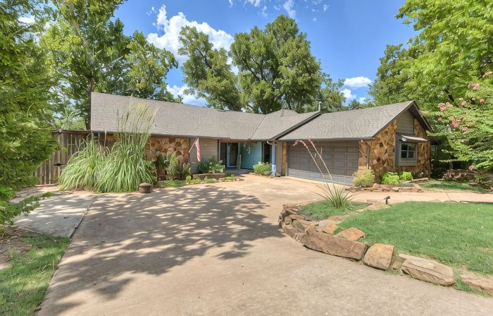 Quiet, spacious home with large deck in secluded Forest Oaks in central Edmond .