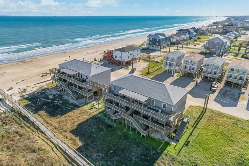Luxury Beachfront Condo with Covered Deck Steps From Beach & Golf Cart Rental - 4-Star