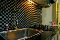 Modern Studio Grand Serpong Apartment by Travelio
