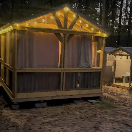Mentone glamping getaway in a private screened in cabin in charming Mentone