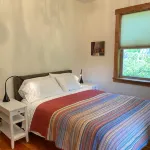 Bright art-filled home, fruit trees, valley view