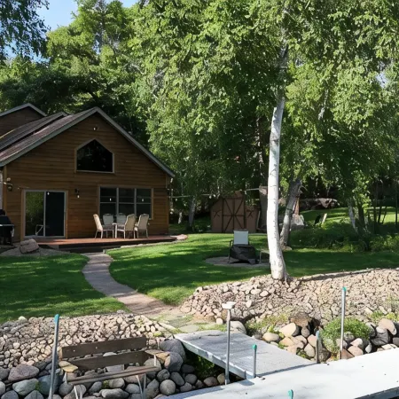Spacious Summer Escape: Private Backyard, Dock & Fire Pit, Channel Waterfront