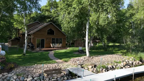 Spacious Summer Escape: Private Backyard, Dock & Fire Pit, Channel Waterfront