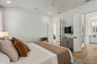 BRAND NEW 4-bedroom, 2 primary suites, heated pool, steps to the beach and river - 4-Star