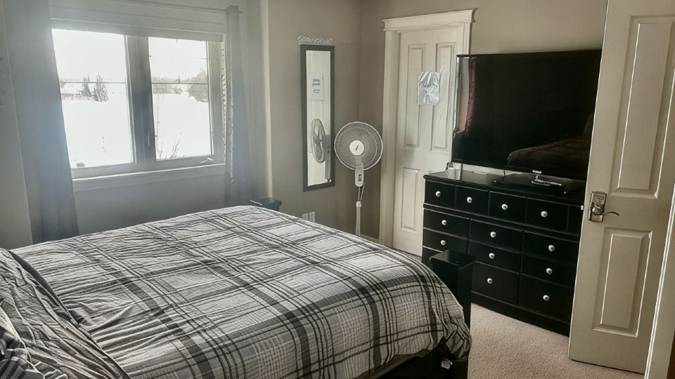 Spacious 4-bedroom townhome in charming Red Deer with WiFi, AC