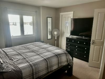 Spacious 4-bedroom townhome in charming Red Deer with WiFi, AC