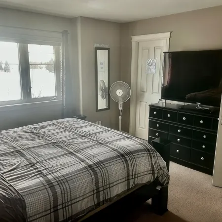 Spacious 4-bedroom townhome in charming Red Deer with WiFi, AC