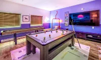 Architectural marvel w/firepit, hot tub, prime location, lounge & bar rooms!
