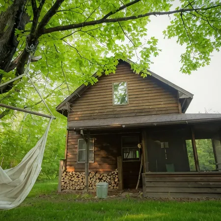 Spiral Staircase Leads To The Lofted Bedroom And Overlooks The Birch Woods.