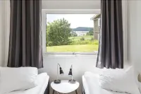 Alkoven Logi Hoteles cerca de Hembygdsgården Bäckaslätt