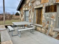 The Stone Schoolhouse - Gated Lakefront Acreage with views and historic charm