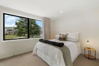 Warm and stylish new home close to river, lake, restaurants and golf course.