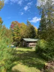 The perfect ADK log cabin getaway on 4 acres and 5 min. to town!