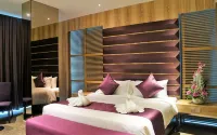 Greens Hotel & Suites - Parkplatz