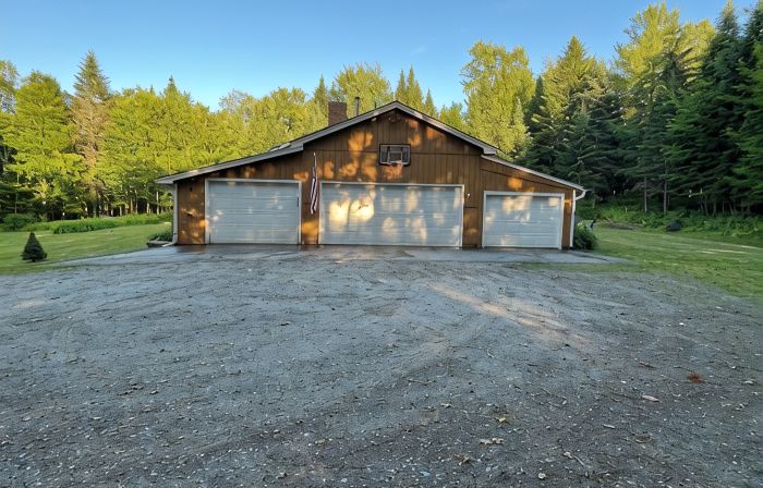 Spacious five-bedroom home off Back Lake with direct trail access on Spooner Rd