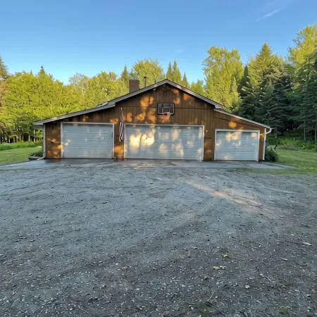 Spacious five-bedroom home off Back Lake with direct trail access on Spooner Rd