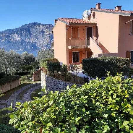 Apartment Agnese with lake view, swimming pool, garage and private garden.