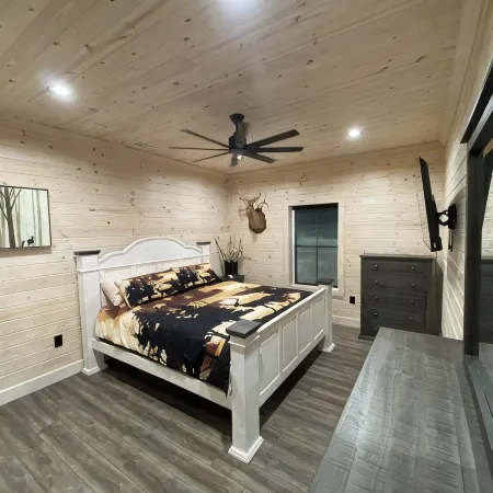 TAKE IT EASY Fishing Cabin. Large enclosed bay for storing the boat.