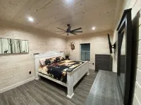 TAKE IT EASY Fishing Cabin. Large enclosed bay for storing the boat.