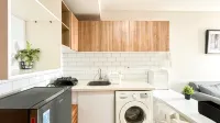 Scandinavian Minimalist 2BR at Cinere Bellevue Suites Apartment By Travelio
