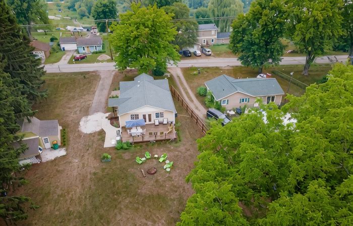 Lake front home with access to two lakes, large yard and RV hookup available!