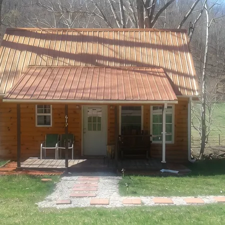 Quaint, secluded cabin with the feel of home. Sleeps 4 with home-like amenities.