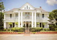 Experience History in an original Carriage House located behind a Colonial home. - 4-Star