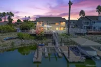 Waterfront modern home Sleeps 6 near Marina w/ Hot Tub, Large Deck, and EVCharge