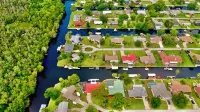 Spacious 3 BR 2 Bath  House On Deep Canal With Screened Heated Pool