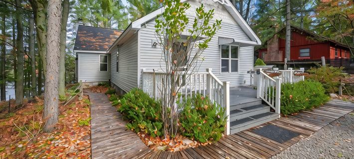 Peaceful Lakefront Retreat w/ Hot Tub, Fire Pit, Game Room, Screened Deck Hotels in Kalkaska County