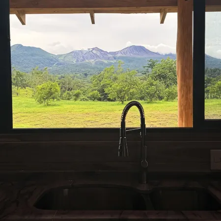 Nestled at the base of Rincon de la Vieja Volcano and bordering the Rio Celeste.