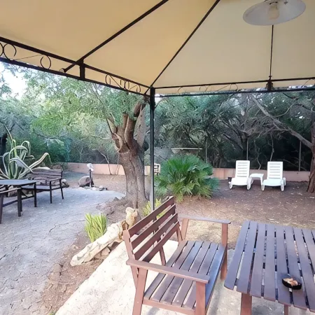 2 bedrooms, 1 living room with kitchen, shower/WC, terraces, Garden, Parking