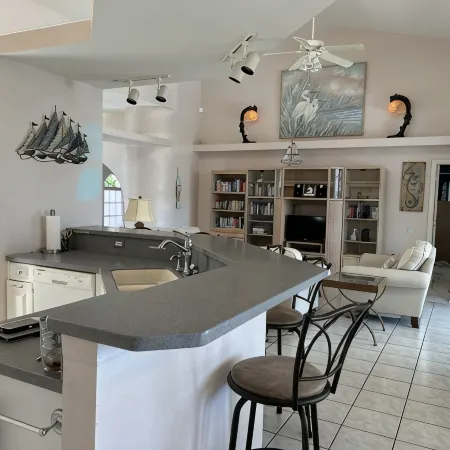 RUM CAY GETAWAY: South facing waterfront home, private pool/spa, bar, and dock.