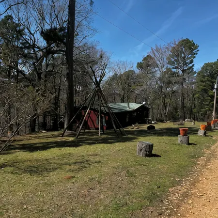 Quiet cabin in the woods w/ access to pools, river, & lakes in gated community!!