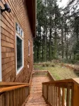 private hot tub, fun game room, cozy beach house