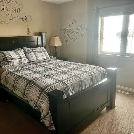 Spacious 4-bedroom townhome in charming Red Deer with WiFi, AC