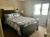 Spacious 4-bedroom townhome in charming Red Deer with WiFi, AC