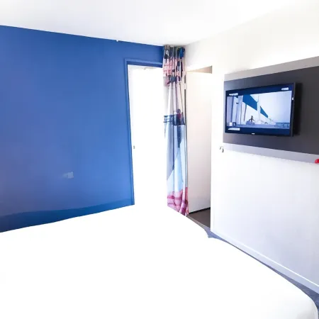 Enzo Hotels by Kyriad Direct Trappes Отели в г. Трап