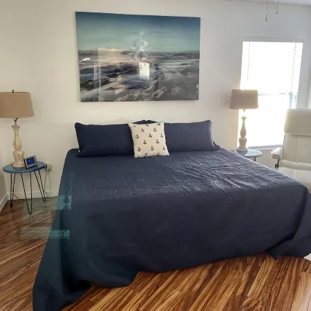 Courtyard Villa with gas golf cart located between two Town Squares!