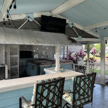 Spacious home directly on Lake Grassy canal. Boat house, hot tub & pool table