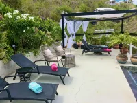 Secluded Island Escape w/ King Bed, Lush Gardens & Shared Pool Access Hotels in Coral Bay
