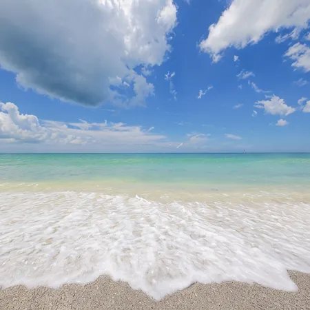 Steps to#1 Rated Beach in USA Spacious2+2Condo,Pool,GarageTranquil Setting