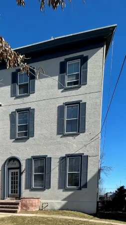 Exposed Brick and Modern Kitchen Amenities - Charming Historic Retreat